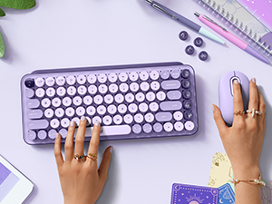 woman using pop keys cosmos keyboard and pop mouse wireless lavender purple